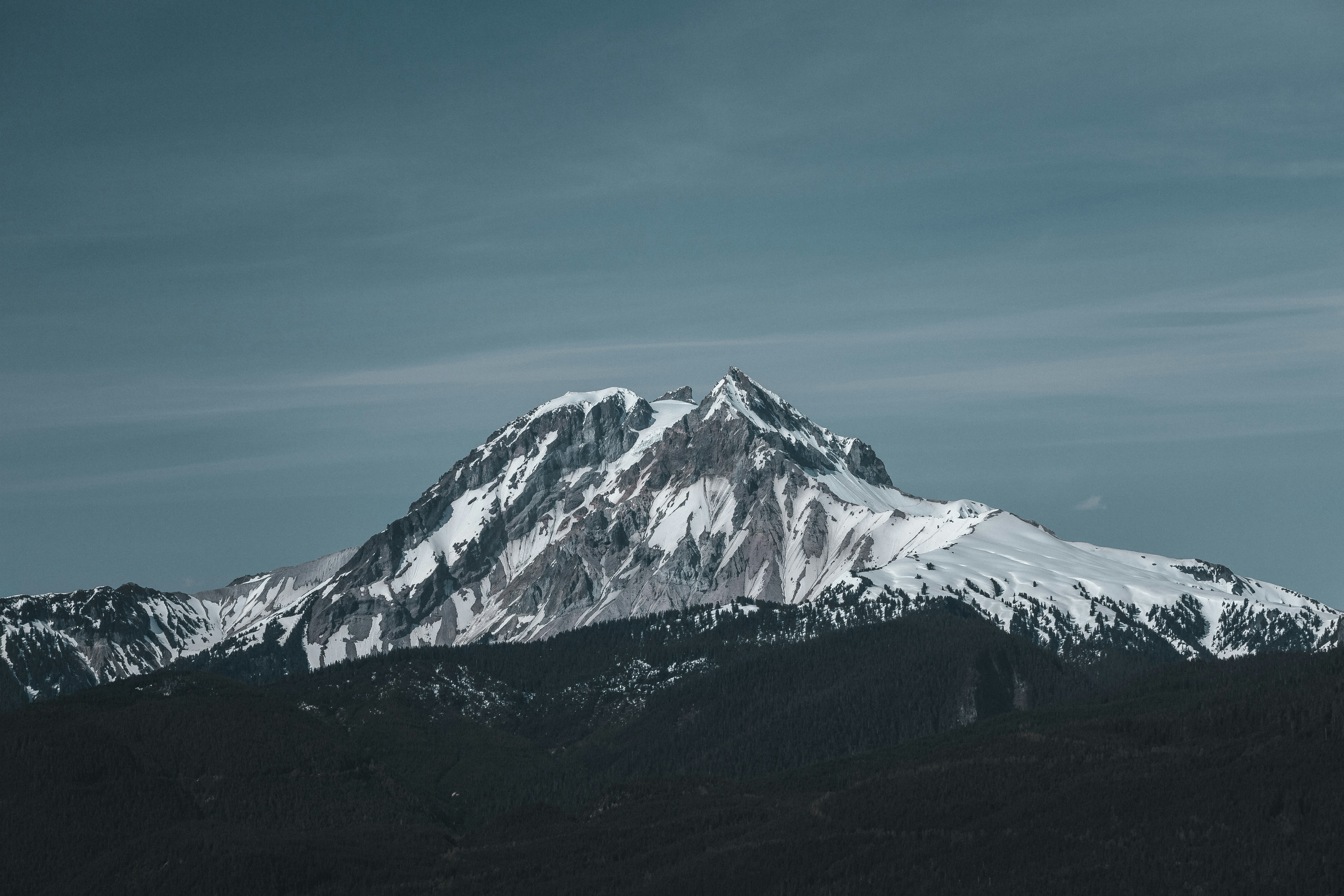 snow covered mountain under blue sky during daytime